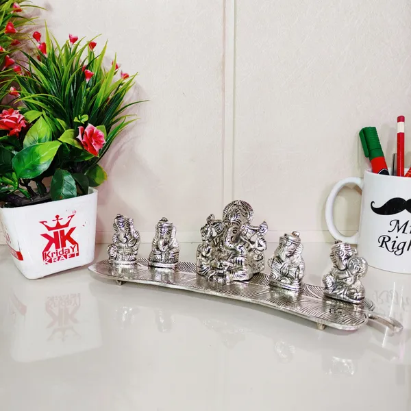 White_Metal_5_Ganesh_Silver_Plated_With_Musical_Instrument_On_Leaf_For_Home_DCor_Musical_Ganesha